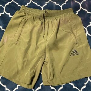 Green, athletic shorts, can be used to practice in any sport, great condition